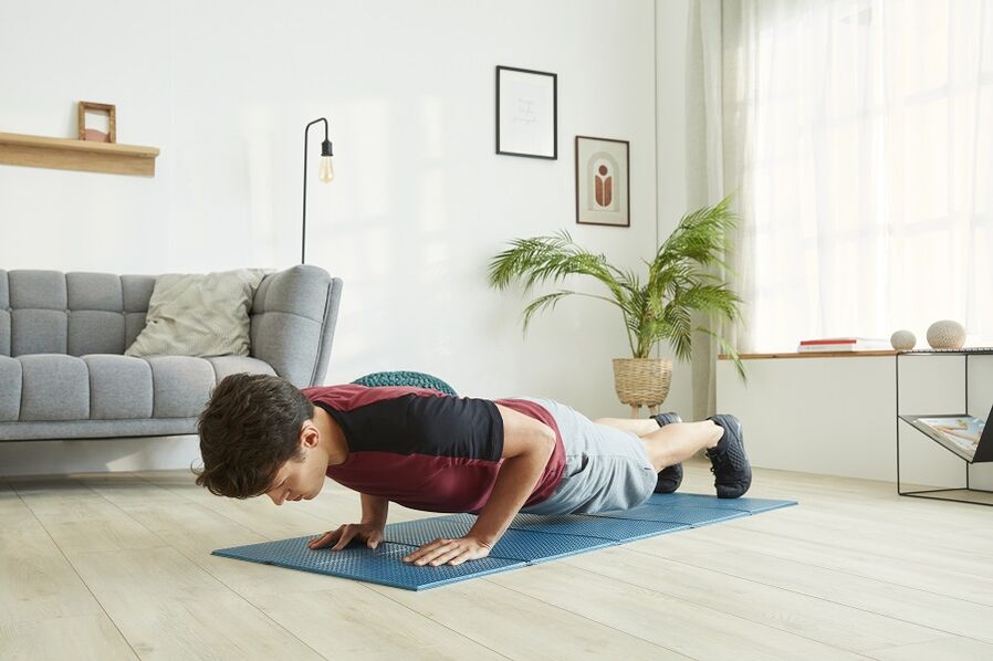 Exercise press and back muscles while standing on a plank